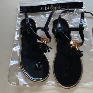 Black and gold tassel sandals